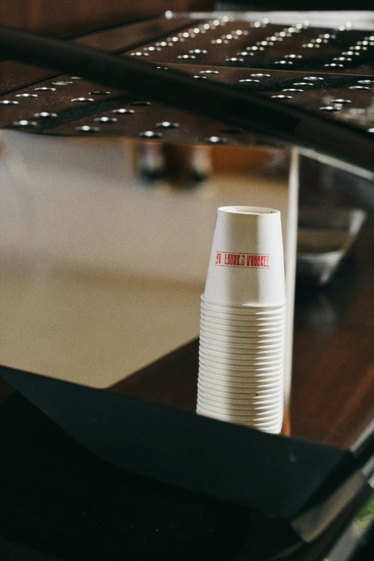 Frank's Market cups lined up on the counter